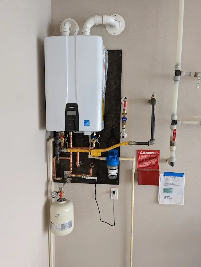 Professional plumber installing copper piping in a Barbecue home